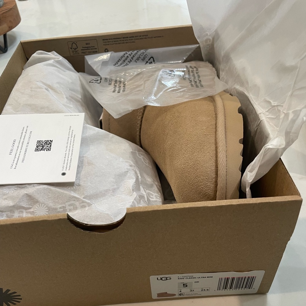Ultra Mini UGG.  Color is driftwood.  Size 5 kids=size 7 womens